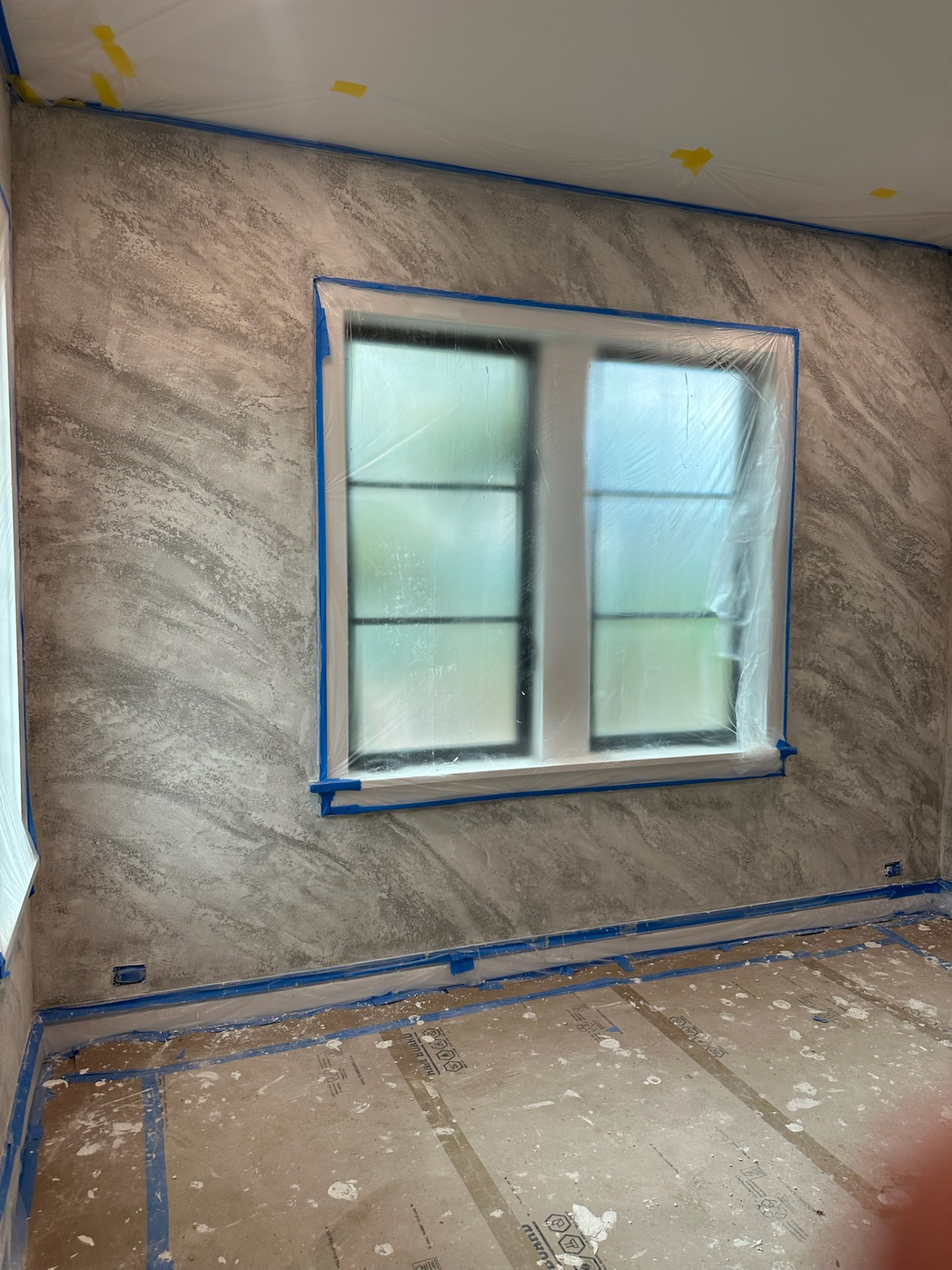 Faux granite split stone plaster texture around window opening, West Palm Beach FL