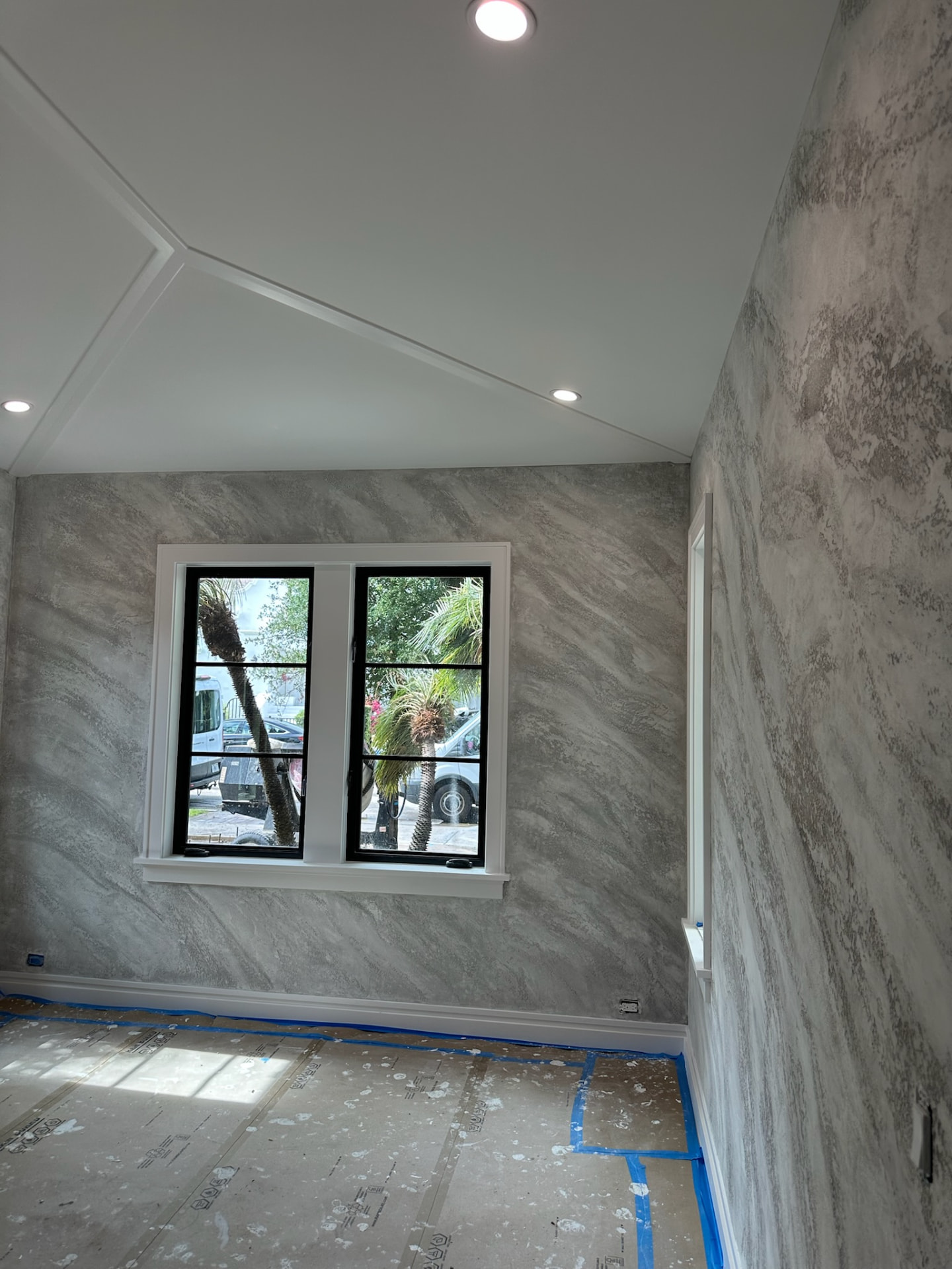 Finished grey and white split stone plaster den walls, West Palm Beach FL