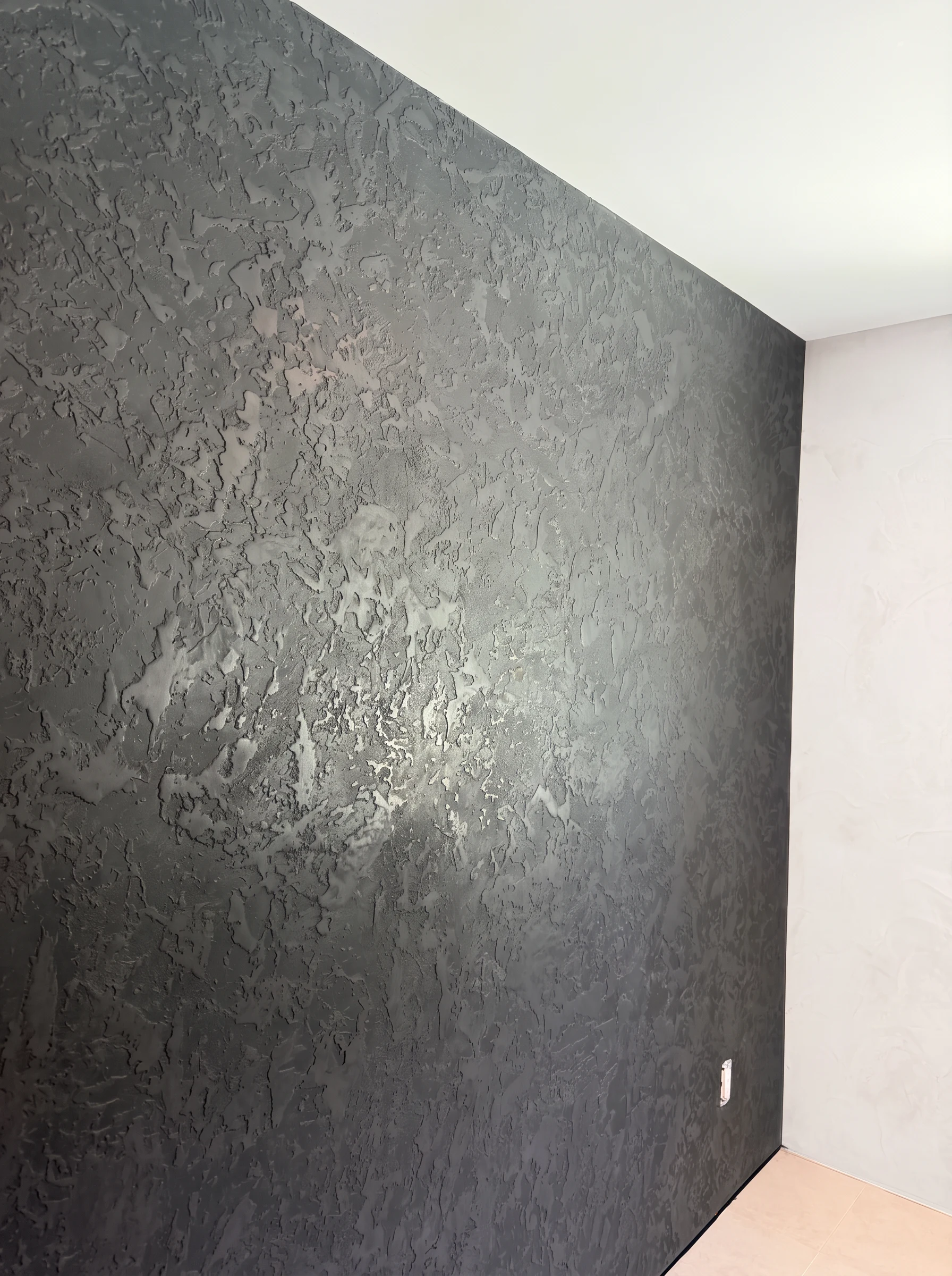 Close-up of thick Italian Stamp Venetian plaster texture lightly smoothed for subtle shine in Palm Beach Gardens, FL