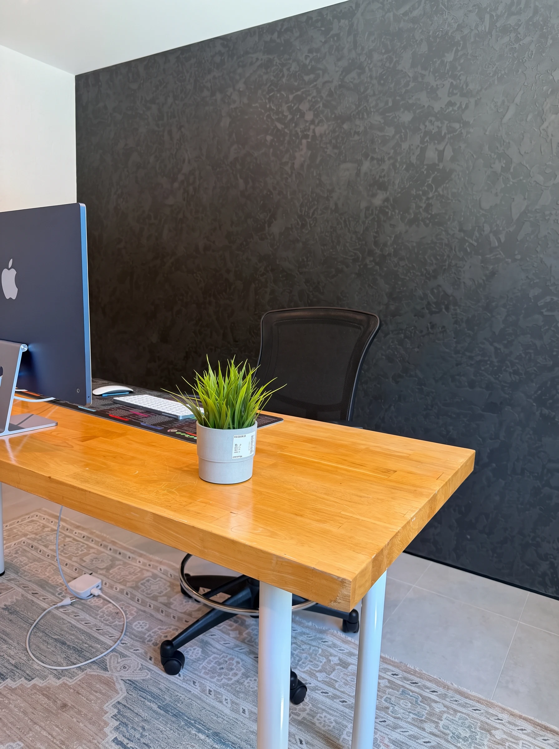 Black Italian Stamp Venetian plaster accent wall behind a home office desk in Palm Beach Gardens, FL